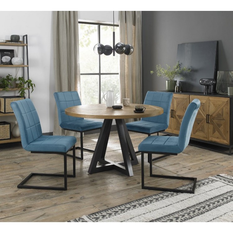 Bentley Designs Indus Rustic Oak 4 Seater Round Dining Table With 4 Lewis Petrol Blue Velvet Cantilever Chairs
