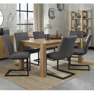 Bentley Designs Turin Light Oak 6-8 Seater Dining Table With 6 Lewis Distressed Dark Grey Fabric Cantilever Chairs
