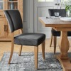 Bentley Designs Indus Rustic Oak 4 Seater Circular Dining Table & 4 Rustic Oak Upholstered Chairs in Gun Metal Velvet Fabric